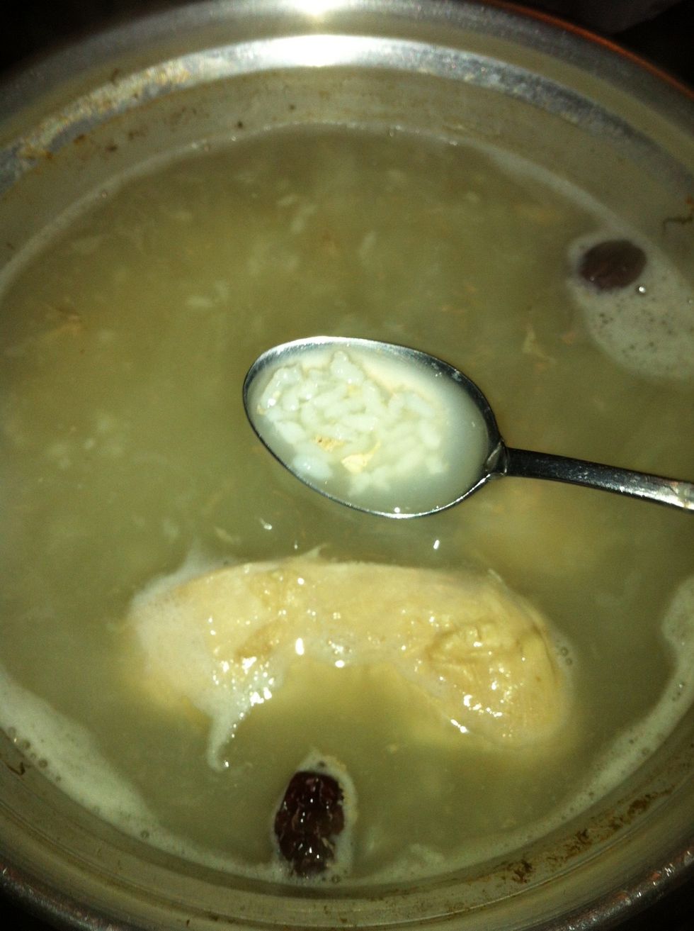 Remove the wood first. Then add the cooked rice to the water and let it simmer for about another 45-60 minutes.