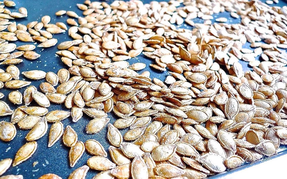 Remove toasted pumpkin seeds from oven to cool on wire rack.