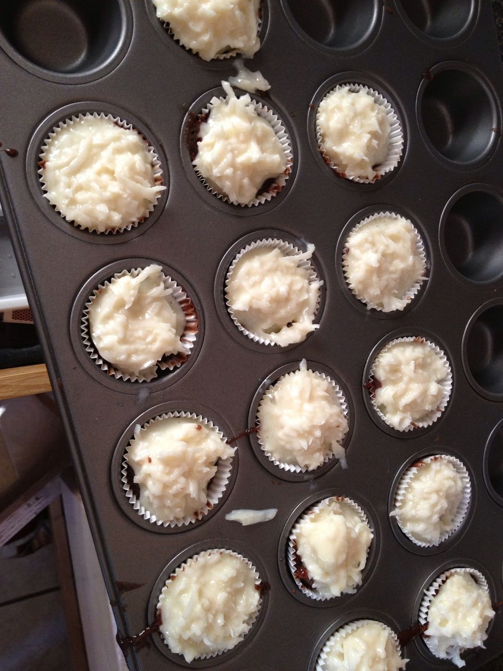 Remove tray from oven and add coconut mixture put back in oven 16-18 mins keep an eye on it.