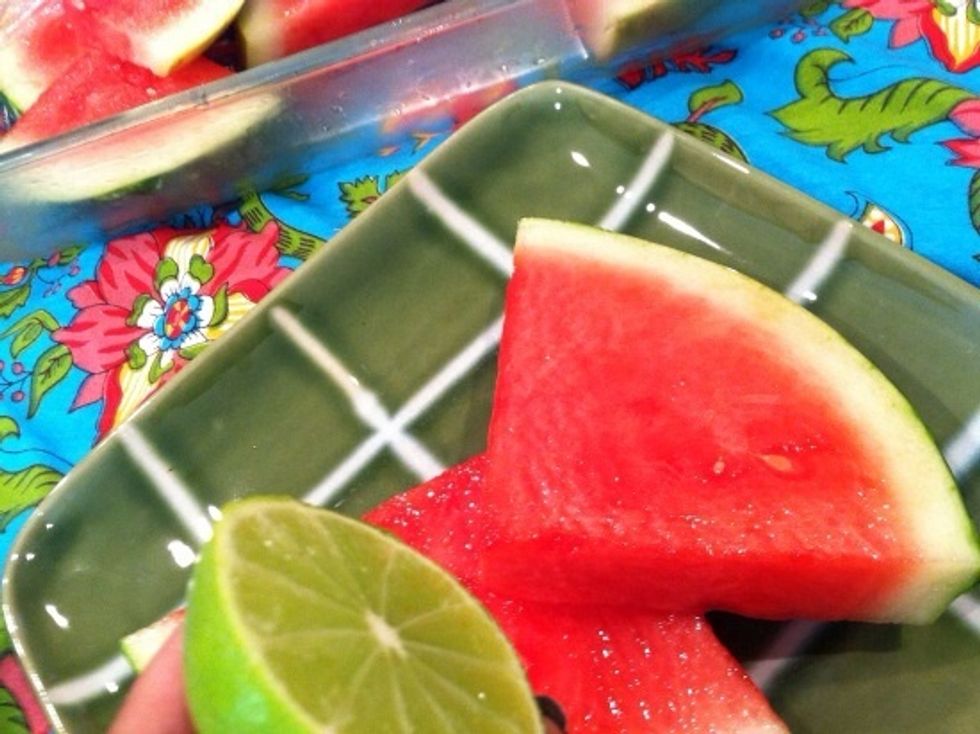 Remove watermelon from syrup, and arrange on a platter. Squeeze limes over melon...
