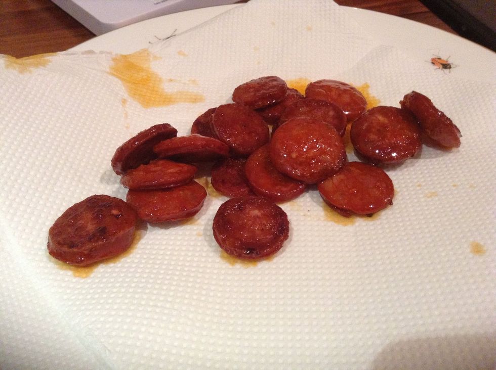 Remove with slotted spoon onto a plate with kitchen paper on