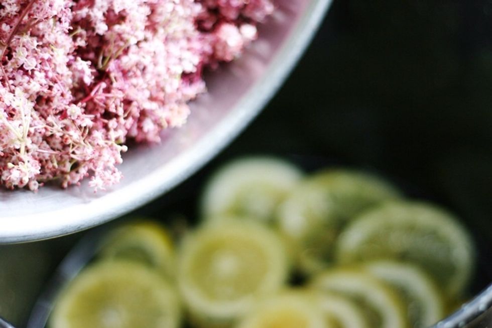 Removing flowers from their stems with a fork first  (as they can impart bitterness) add the flowers to your pot , stir and leave to cool. Cover with a kitchen towel and leave to sit for 48 hours.
