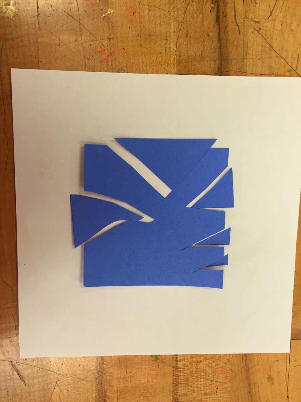 Repeat cutting shapes on all 4 sides of the square. Keep track of the shapes and make sure they match the correct space. Try cutting geometric and organic shapes for variety.