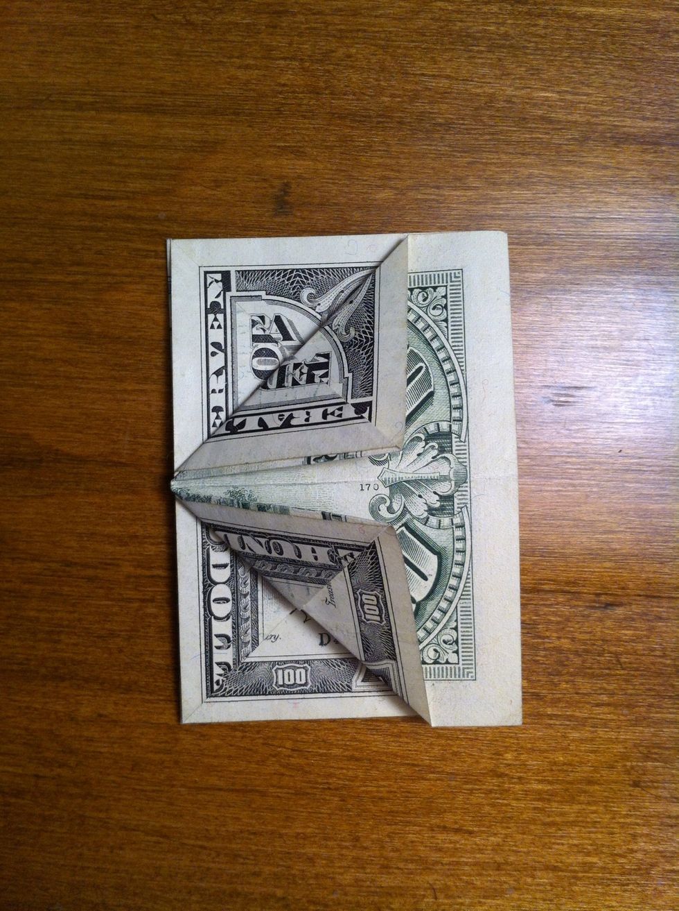 Repeat fold on the other corner then flip your bill and do the same to the other side.