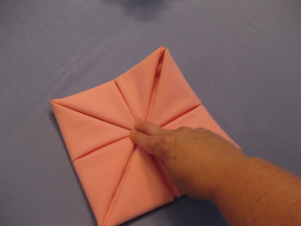 Repeat for all four corners. Keeping ahold of the center, in case your napkin isn't sturdy enough.