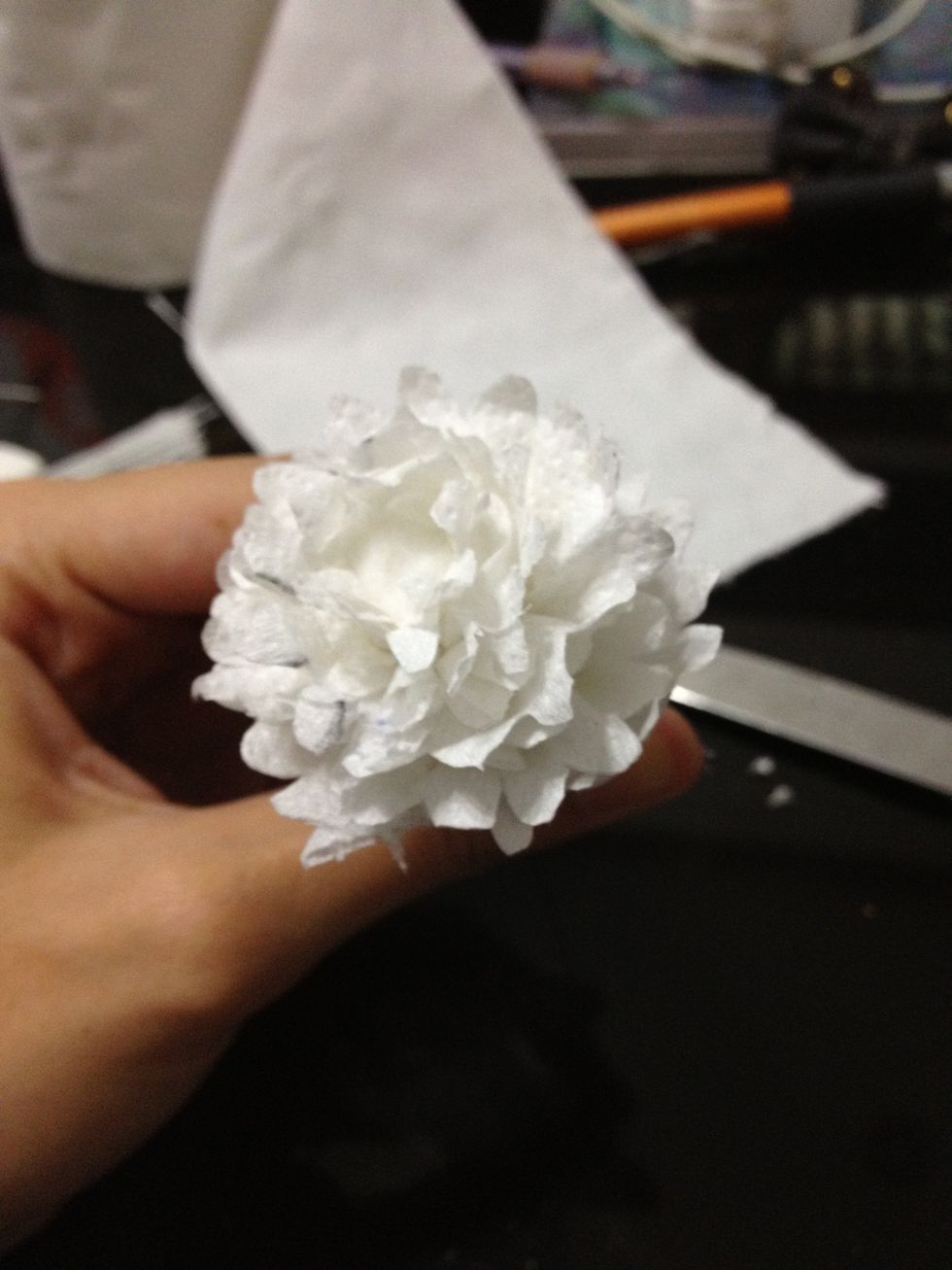 Repeat for the next two pieces of tissue paper. This is the finished third paper, which means there must be a total of 6 layers of petals on this.