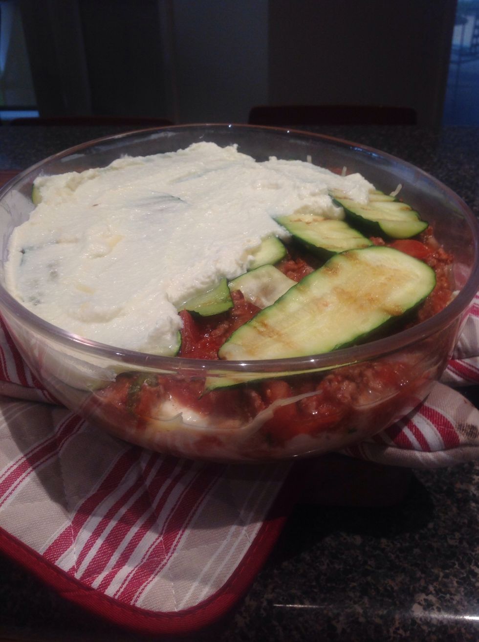 Repeat layers until there are no ingredients left. Last layer should be the cheese mix. Bake in oven for 10 minutes.