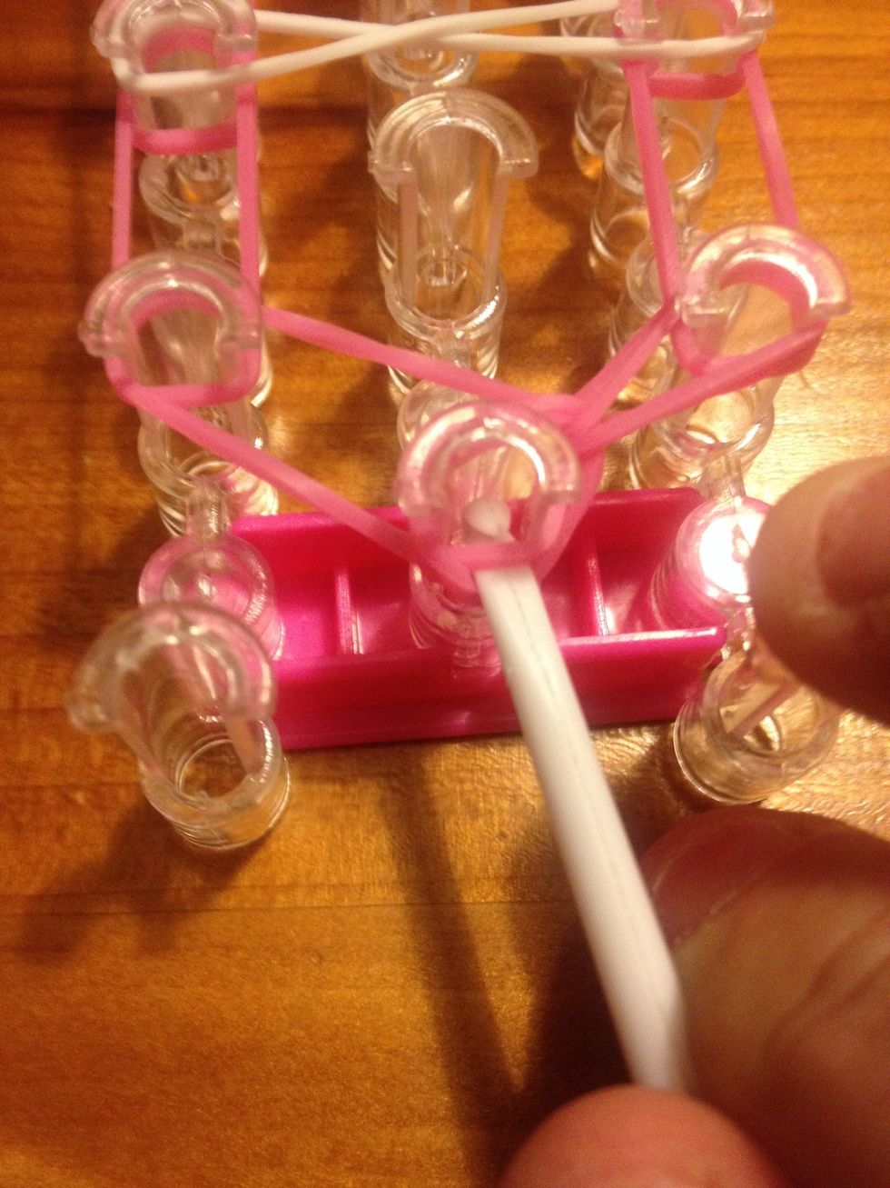 Repeat process of goin in the middle of the hook and get in the next bottom band