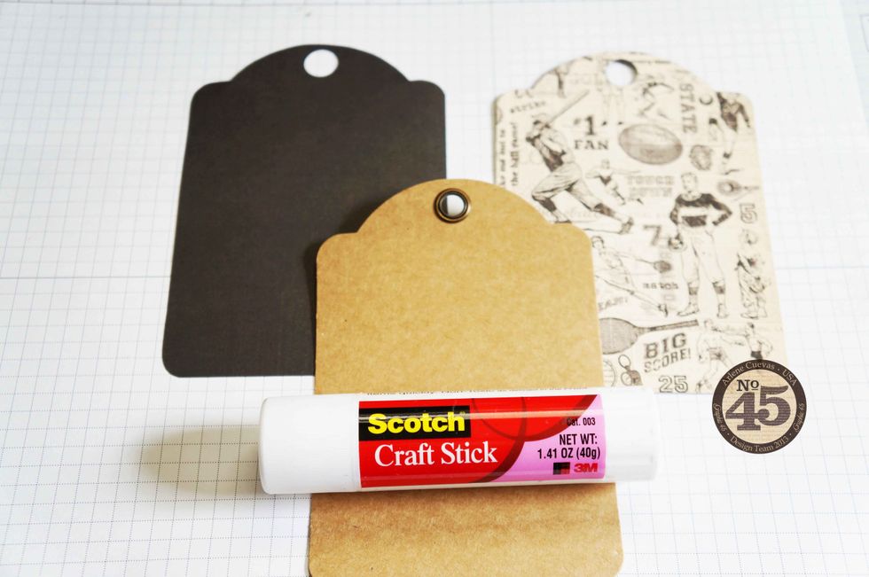 Repeat so you have design paper to cover both the front and back of the tag. Use a strong adhesive to prevent peeling. I use a Scotch Glue Stick to ensure even coverage.