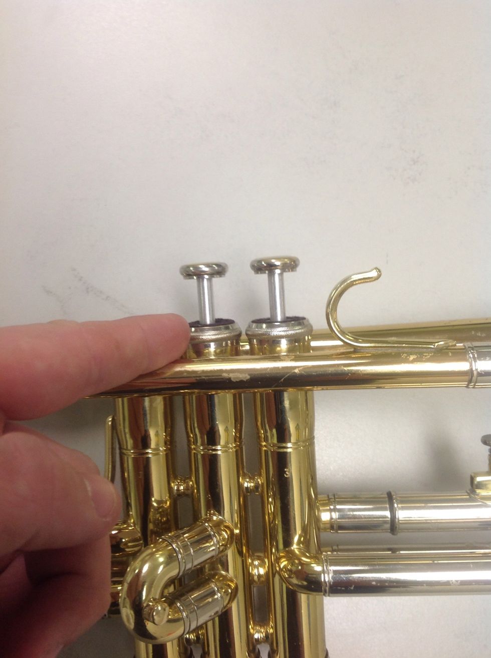 Repeat step 1 for the rest of the valves until all valves have been unscrewed and removed from the trumpet