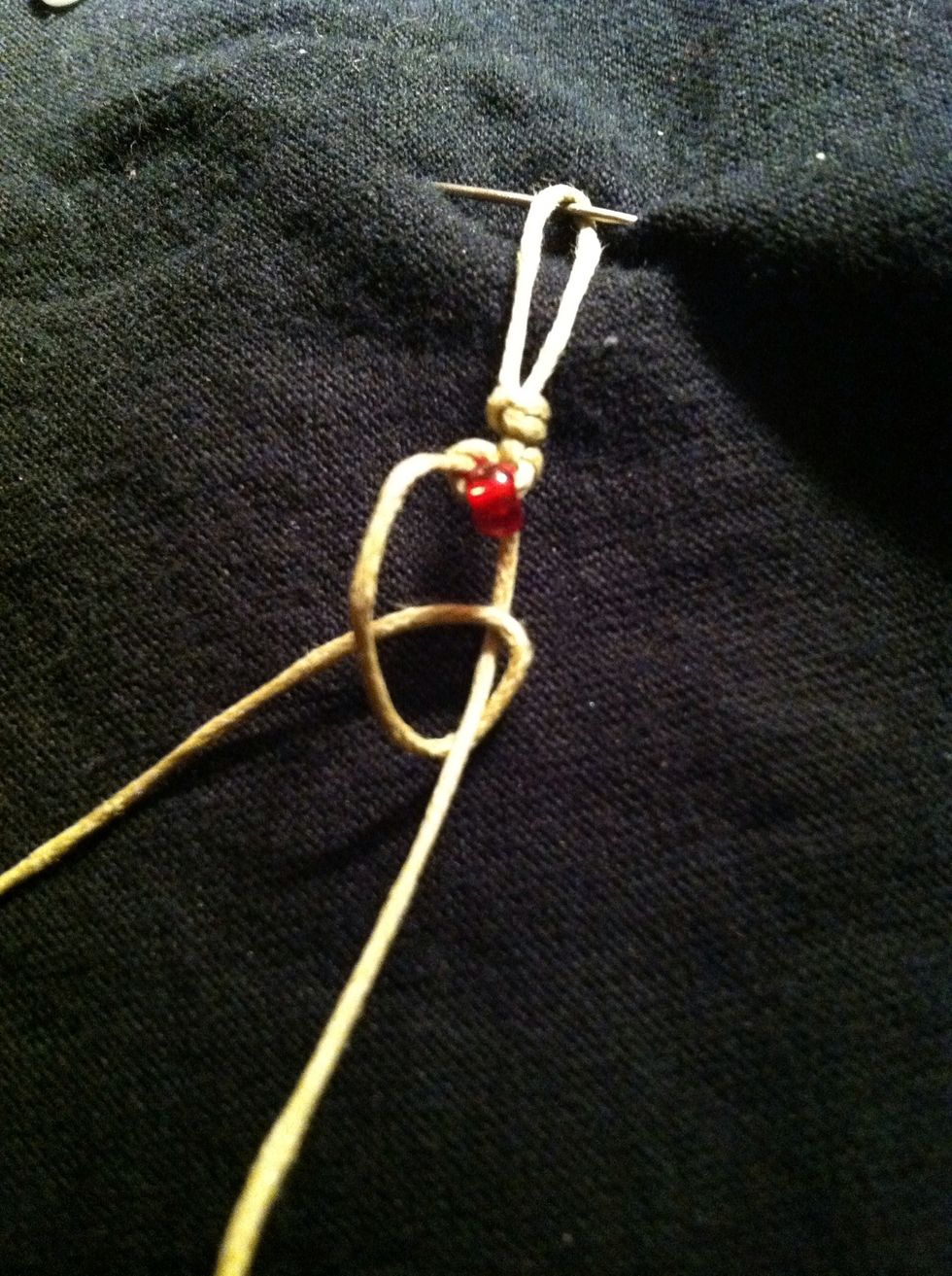 Repeat step 10, tying the left strand (notice no  bead) over the right.