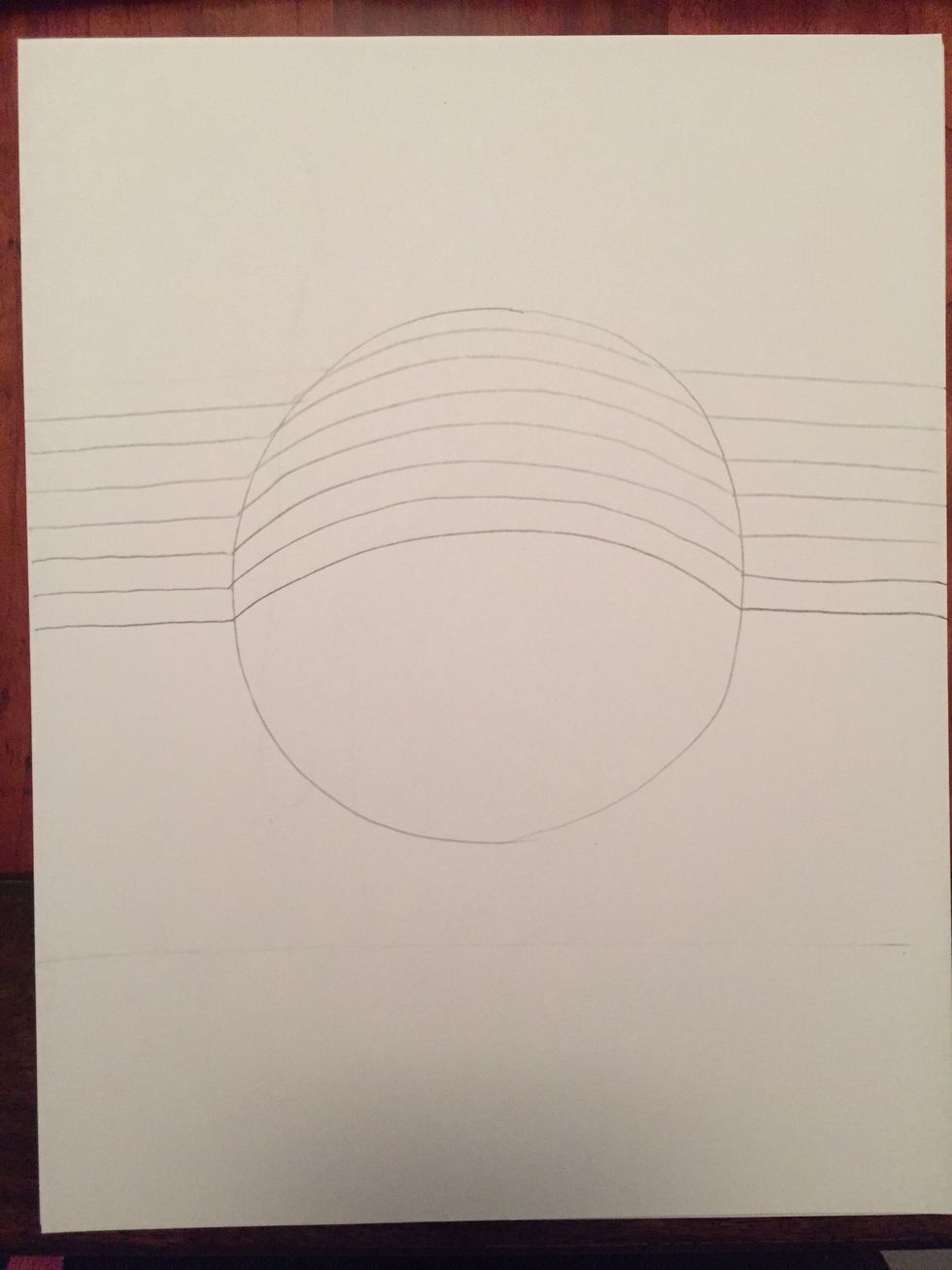 Repeat step 2 until you have filled the top half of your circle with curved lines.