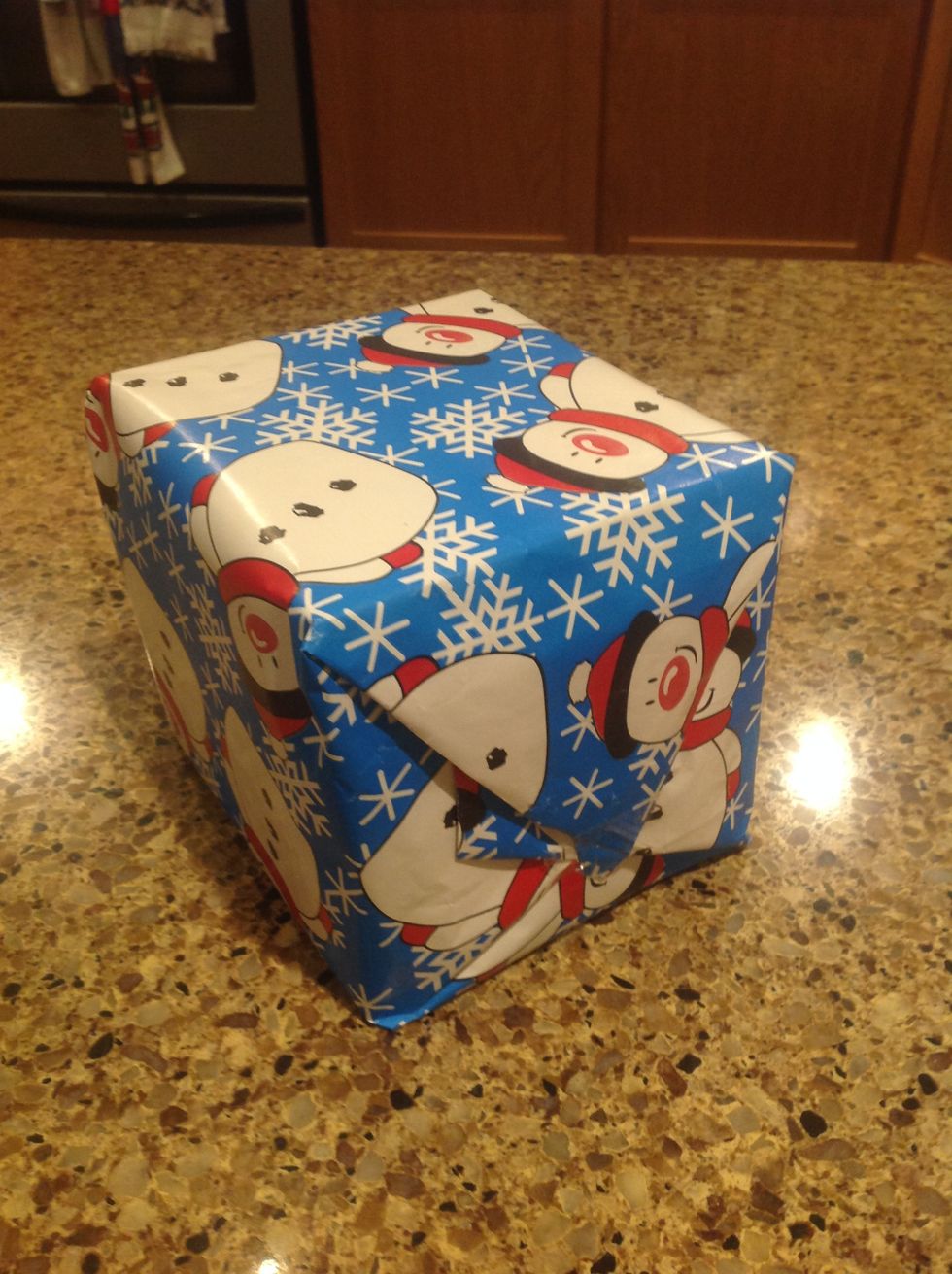 Repeat Step 8 on the other side of the gift and flip it over so it is now facing upwards (triangles should be pointing down).