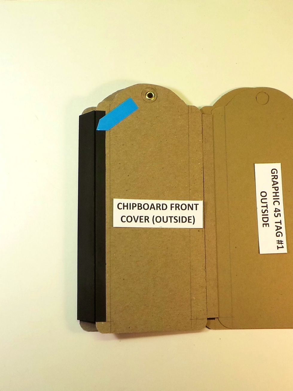 Repeat Steps 32-33 to fold the Tyvek over the opposite edge. Burnish well. When completed, the Main Spine should look like this with definite creases where spine meets tag.