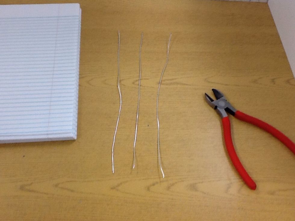 Repeat that until there are three strands of wire.