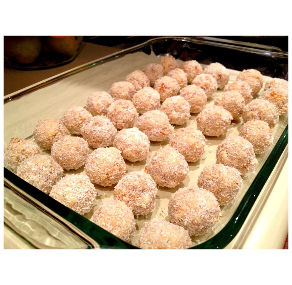 Repeat the ball-rolling process quickly, using the stickiness of the condensed milk to help shape and bond the coconut. I usually make 45 little balls, each about two-bites worth.   Eat, share, enjoy!