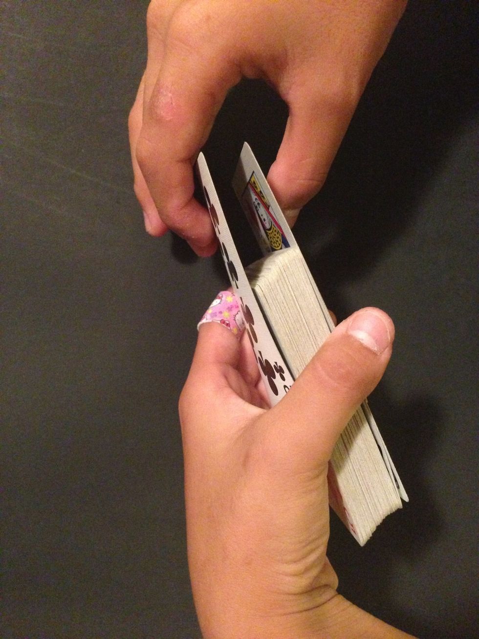Repeat the process about four times. But on the fourth time put the cards on the bottom.