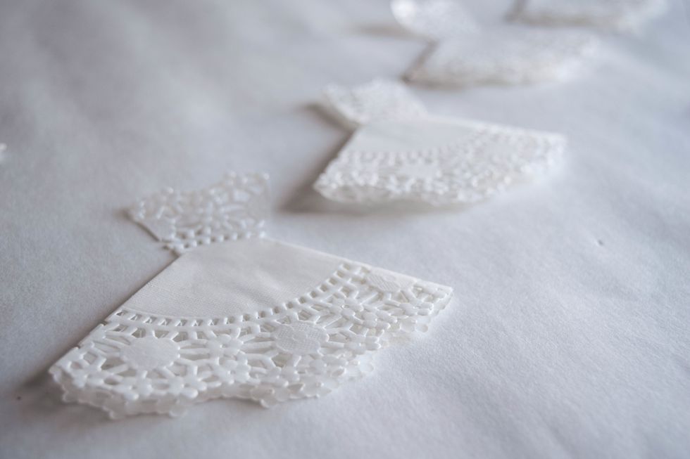 Repeat the process to make as many dresses as you want for your garland.