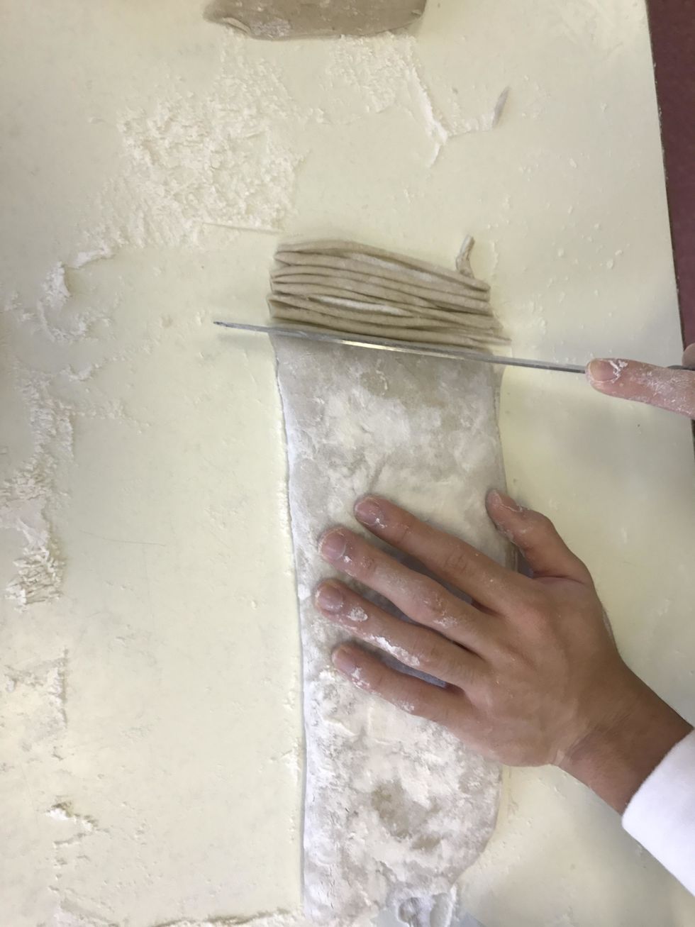 Repeat the process until all of the noodles are cut out from the dough.