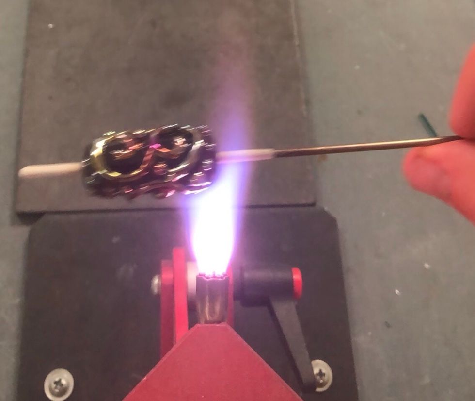 Repeat the reduction using quick passes through the flame.