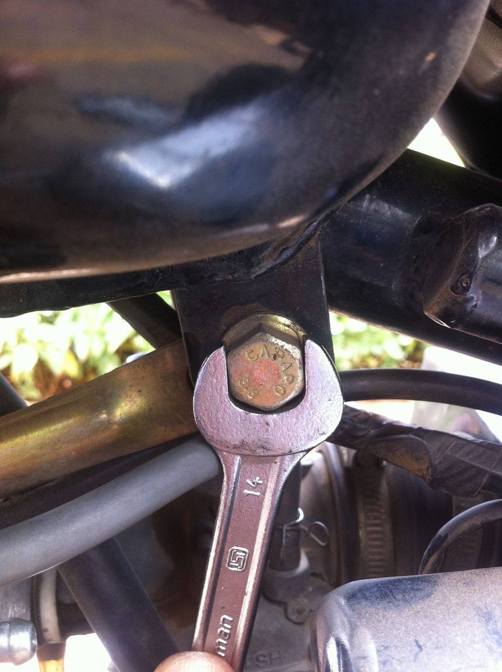 Repeat the removal procedure at the rear side using two 14mm spanners.