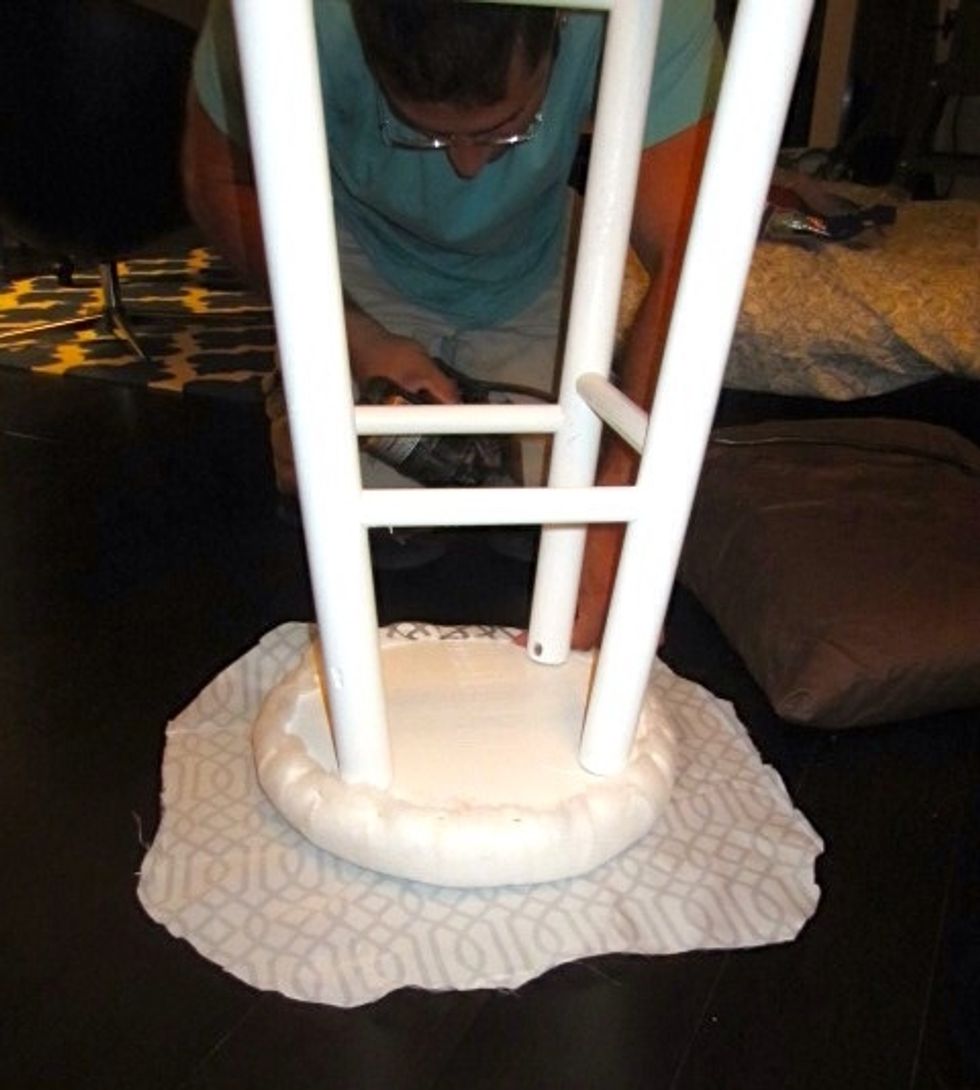 Repeat the same process as before with the fabric, pulling tightly and securing with the nail gun.