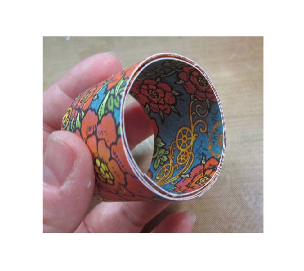 Repeat the same process with the extra strip but adhere it to the inside of the roll.