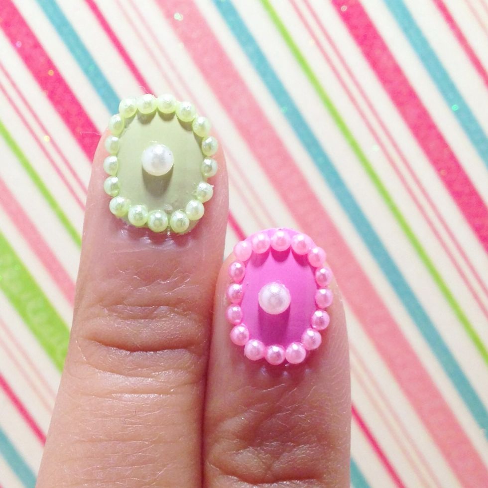 Repeat the same step until border is finished. Using the same method pick a large white pearl and place it in the middle.