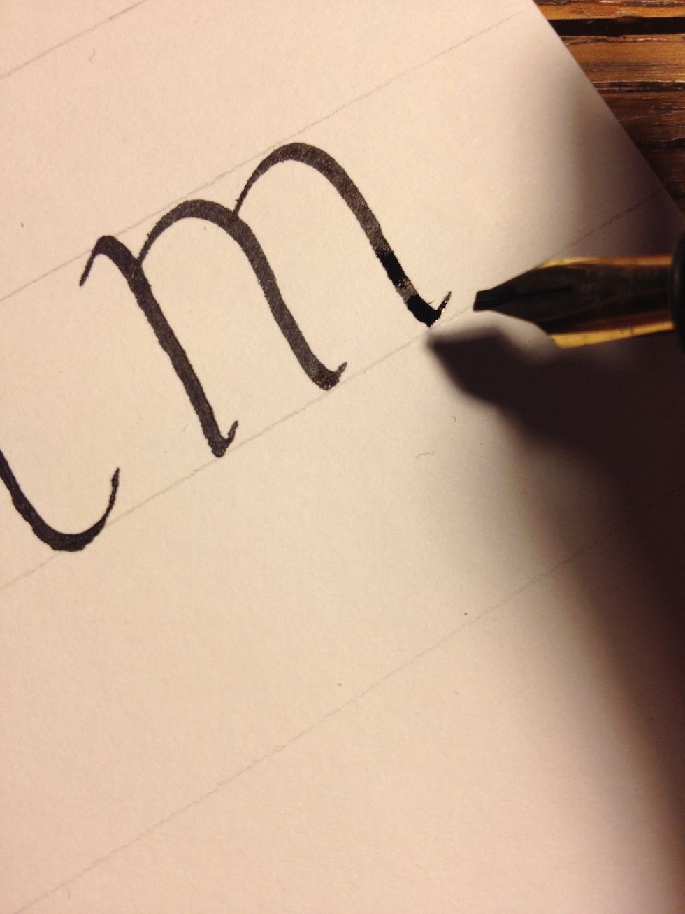 Repeat the second stroke a second time to complete the letter.