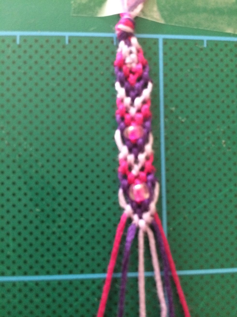 Repeat the steps creating the double knots on each thread, adding beads as appropriate.