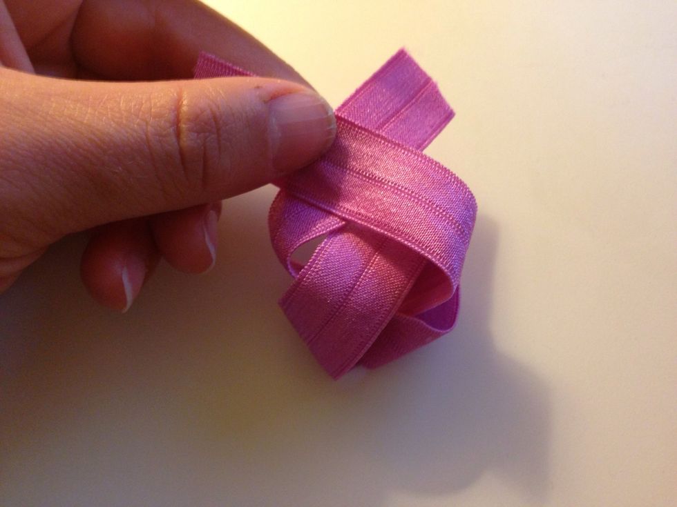 Repeat this one more time so you will have a knot at the top of your hair tie.