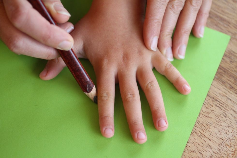 Repeat this process with other people's hands, such as your children's \u2014 using different hues of green \u2014 to add texture and meaning to your wreath.