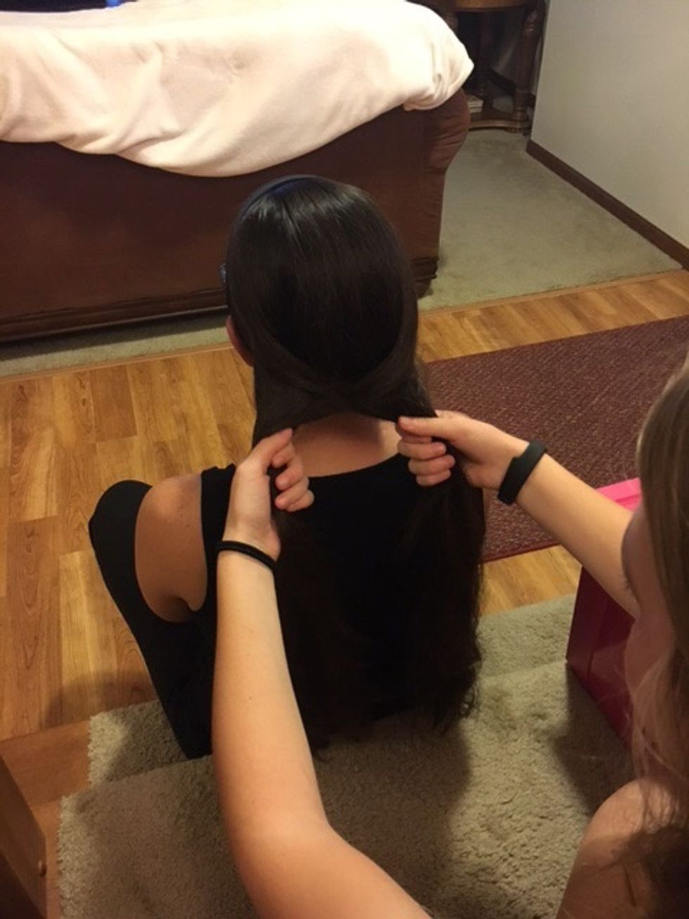 Repeat those steps, bringing hair from the right to the left and then the left to the right each time.