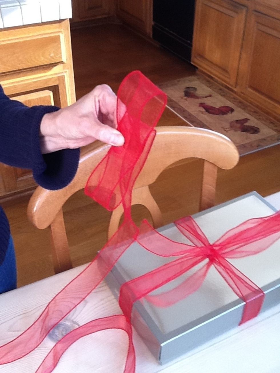 Repeat with a bottom loop keeping your fingers in the center