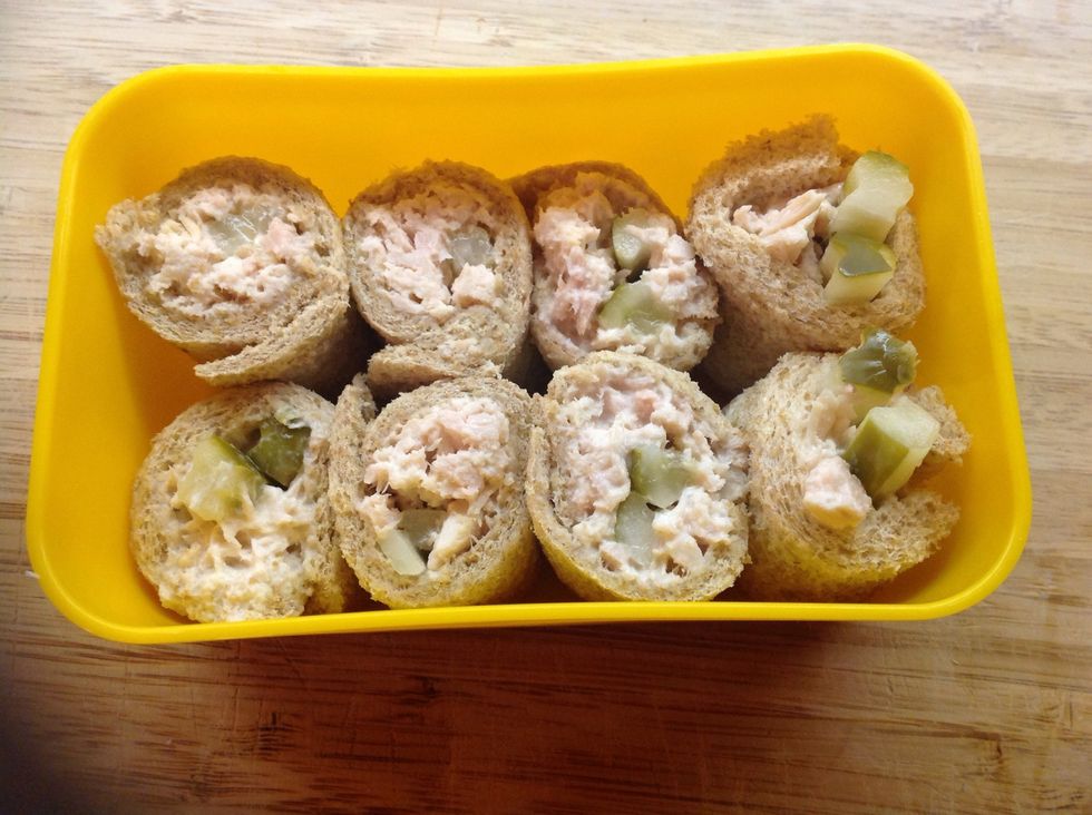 Repeat with a second slice of bread and the remaining tuna and pickles. Tuck the pieces in a small container, and you're ready to go!