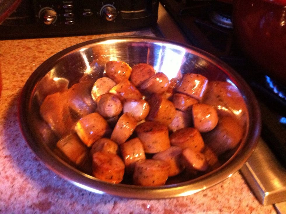 Repeat with the kielbasa. Cook until brown on all sides. Remove to the serving bowl.