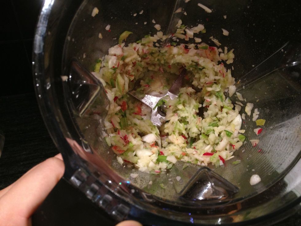 Repeat with the second half of the fruits and vegetables. When chopped, add them to the colander to drain. Let excess liquid drain for 5-10 minutes.