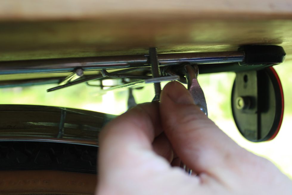 Replace the bolts passing the them through the bar and the appropriate hole in the trunk so the threads are visible on the inside of the trunk.