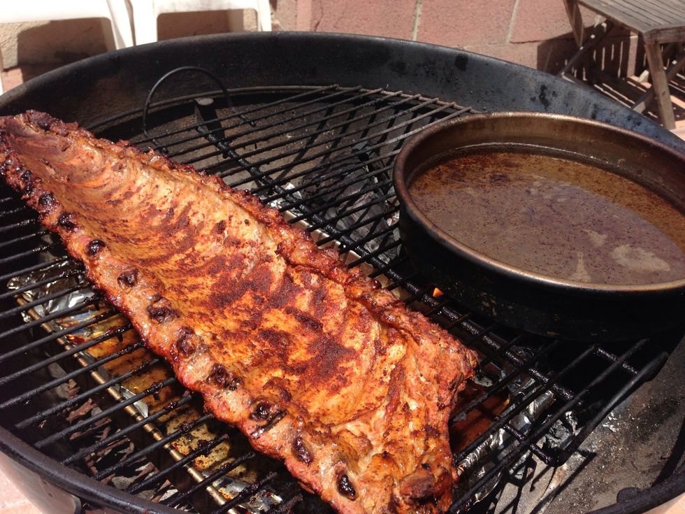Replace the grate and flip the ribs, bone side down and replenish the water in the upper pan\u2026Cover the grill and cook another hour, undisturbed\u2026 And go have a drink or 2. Oh, and skip the mops folks