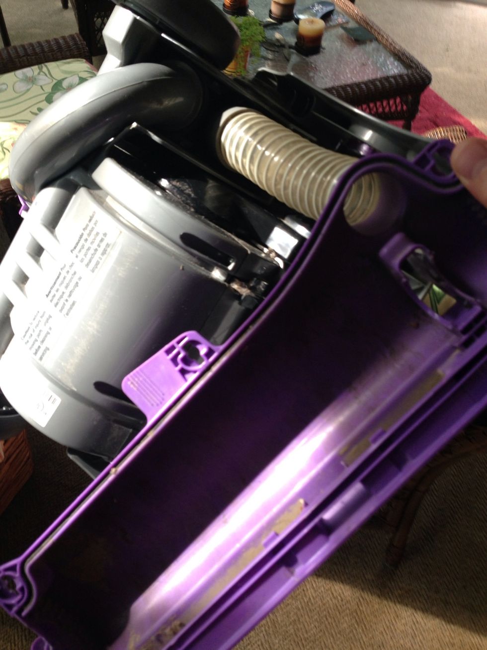 Replace the housing cover. First attach the plastic tube. Inspect the tube. Make sure there are no cracks in it that would cause vacuum loss. Snap the housing in place firmly. It won't break.