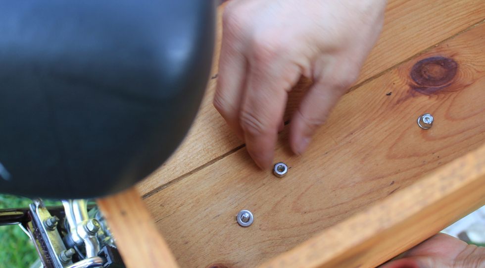 Replace the washer and nut and tighten to hand tight.  Repeat for the second bolt.