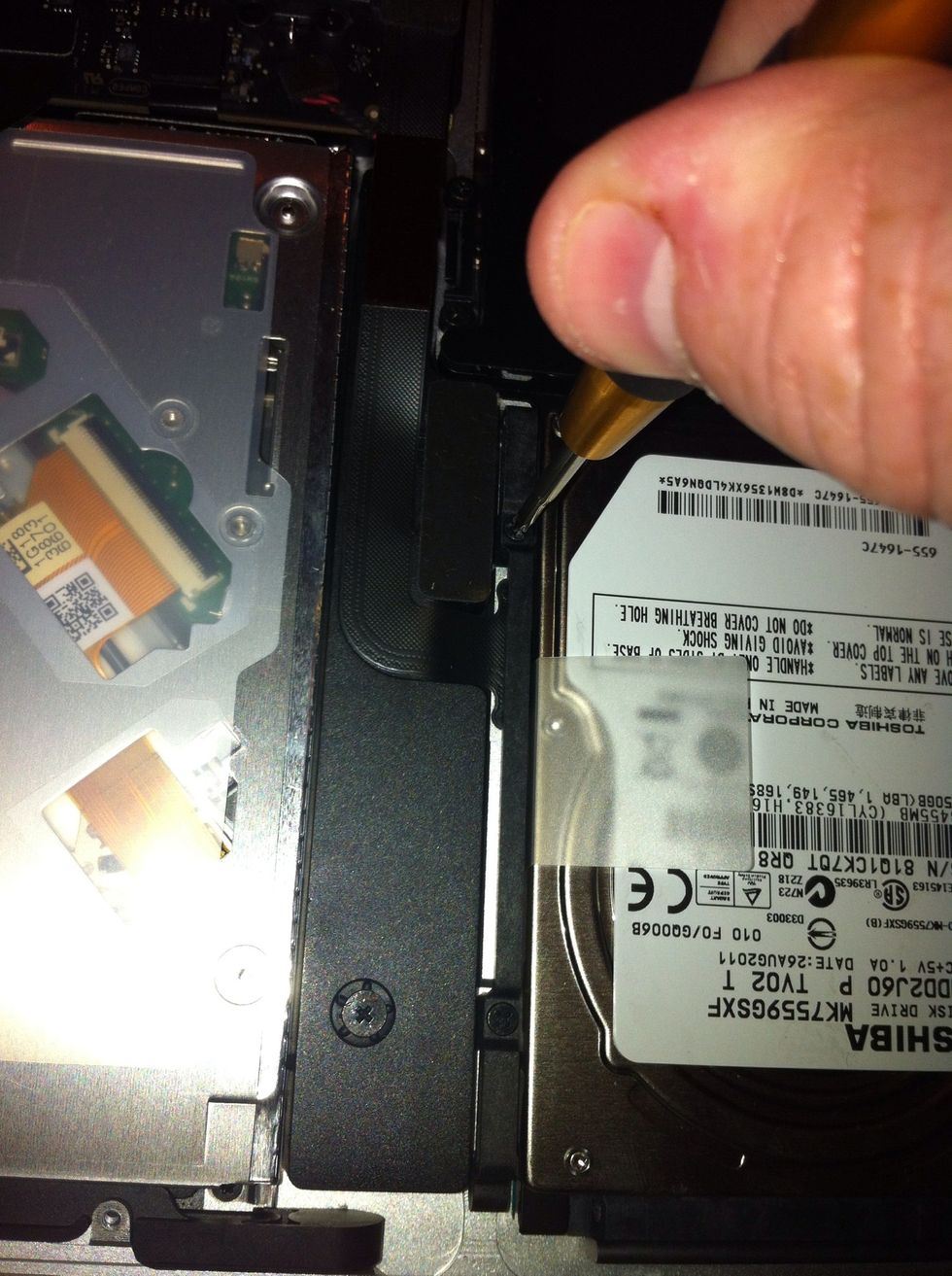 Replace your bracket and tighten all 4 screws to hold your new drive in place