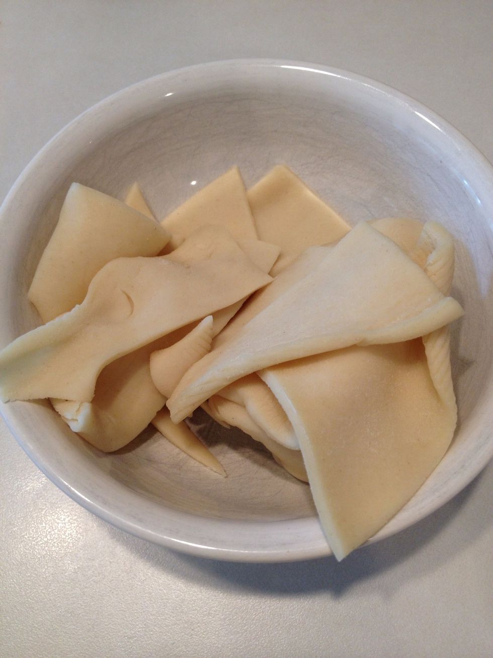 Reserve 5 rectangles to make for the tops of your pie pops.  Set aside.  Put the rest of the dough in a bowl to use as needed for the next few steps. (Unused dough can be frozen for more pops later.)
