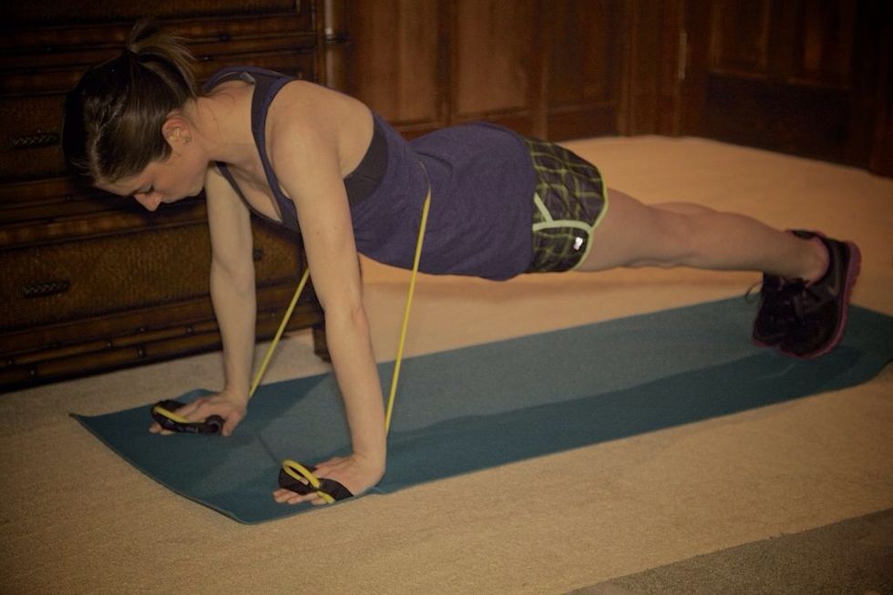 Resistance Band Push-up: Wrap the band around you and hold it tight in each hand so it is stretching when you rise up. Complete as many of push-ups as you can in 1 minute. You may cry a little...