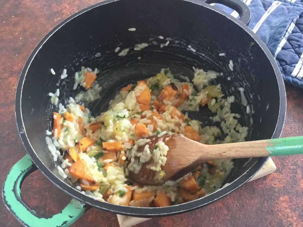 Resting the risotto allows time for the final absorption of moisture.