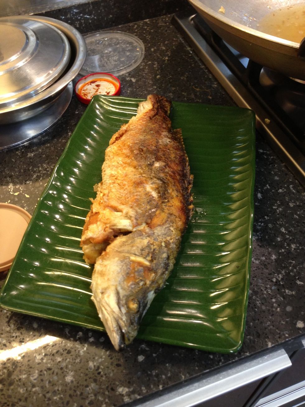 Retain some oil in the deep frying pan. Keep fish aside and cook sauce next