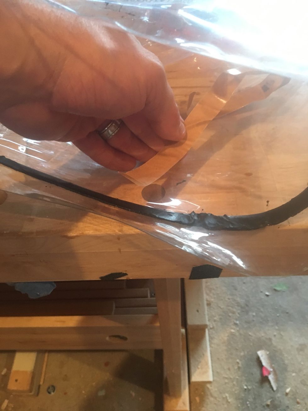 Retrieve sealing tape from inside vacuum bag.