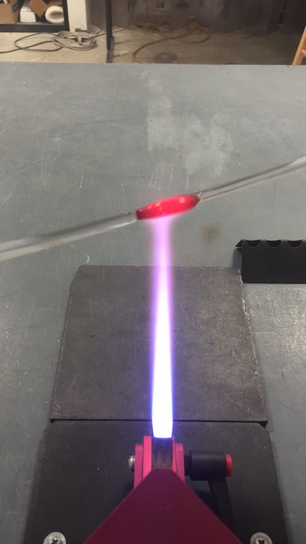 Return the flat patty to the cool, outer reaches of the flame. Heat both sides gently, moving it around so the patty has an even heat base.