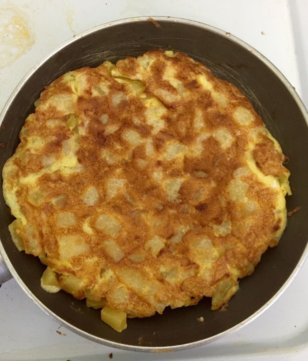 Return the omelette to the pan to cook the other side. It will take a lot less to cook