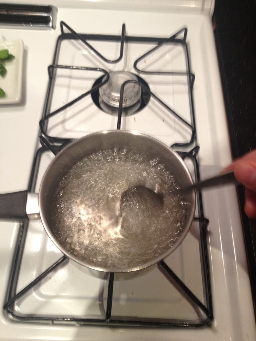 Return the sugar water to a boil as you stir. Once boiling, stir for a few more moments, then turn the heat off.